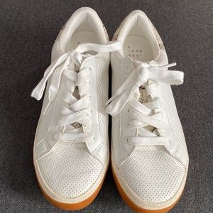 White sneakers worn once. Cute snakeskin detail on the back.